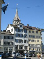 Zurich, Mnsterhof (Cathedral's Yard), row
                        of houses with the steeple of Peterskirche (St.
                        Peter's Church)