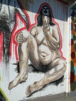 Zurich, Zollstrasse (Customs
                                Street), graffiti with a naked woman in
                                a sitting position in the pose of
                                desire