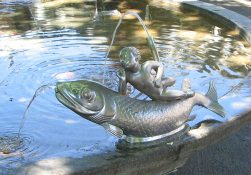 Zurich, Bellevue Fountain, fish sculpture with a
                boy, taken half inclined