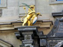 Town hall of Zurich, entrance with golden lion with
                pen and shield, left side