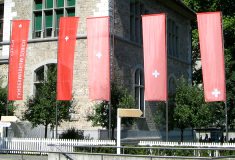 Zurich, State Museum, Swiss flags at the
                        entrance