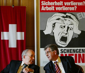 Ueli
                            Maurer presenting horror posters in Nazi
                            colors against Schengen agreement in April
                            2005