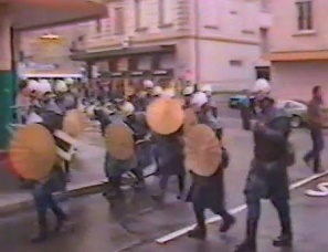 Bully police (Martians) of Zurich
                            Town, they come with shield and stick and
                            with tear gas pistols and rubber bullets
                            hidden behind the shields, 1984