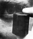 Rubber bullet compared with
                                    an eye, zoom